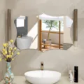 Decorative irregular wall mirror detail in modern bathroom scene with warm tiles and lighting. - JM710