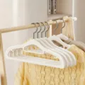 White plastic clothes hangers with non-slip design and stainless steel hook for home wardrobe. - Double Position Style / Ivory