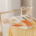 Plastic clothes hanger, non-slip wide shoulder design with 360-degree rotatable hook. - Double Position Style / Monsoon Orange