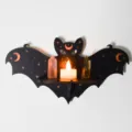 Gothic bat wall shelf detail showing celestial moon star print with crystal and candle decor. - MZ231