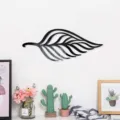 Detailed view of black 3D leaf acrylic mirror wall sticker mounted on a clean white interior wall. - Black Size L / JM1087:2mm