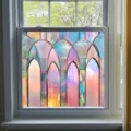 Detailed close-up view of the colorful decorative window film applied on a clear glass window. - BL301 / Small Size 50x50cm
