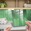 Peel and stick tile sticker with crystal epoxy finish and green peacock feather pattern for decor. - 10x10 cm - 25 Pieces / DJ055