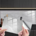 Grey marble texture crystal tile sticker peeling detail showing self-adhesive backing. - DLS102 Crystal Film