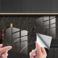 Detail view of self-adhesive marble pattern tile sticker showing peeling backing paper. - DLS112 Crystal Film