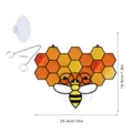 Stained glass bee honeycomb hanging ornament detail, showing metal chain and suction cup accessories. - TYU172