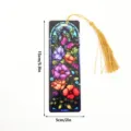 Translucent acrylic bookmark featuring colorful stained glass floral design and gold tassel. - SQTYU029