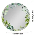 Vista detallada de un espejo circular acrílico para taquillas con diseño de hojas verdes. - CTJM017