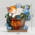 Detail shot of stained glass style sleeping cat acrylic tabletop ornament with blue flowers. - BTU490