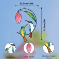 Detailed view of stained glass hummingbird and flower window hanging with dual-sided color. - JSTY363