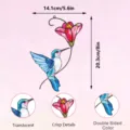 Detail view of double-sided metal hummingbird wall hanging ornament with translucent stained glass style. - JSTY368