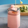 Pink automatic pop-up toothpick dispenser container for home kitchen and dining table use. - Pink