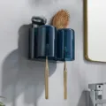Wall mounted toothbrush holder set with dark blue mouthwash cups and storage rack. - 2-Cup Toothbrush Holder (Translucent Blue)