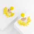 Detailed view of handmade yellow beaded tassel earrings with metal half-circle pendant. - Yellow And White (No.7)