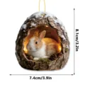 Acrylic hanging ornament featuring a cute rabbit in a tree hollow design. Perfect for holiday decor. - Tree Hole Rabbit