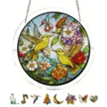 Detail view of the stained glass hummingbird acrylic suncatcher with colorful floral puzzle pieces. - PT-TYU020