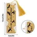 Detail view of the acrylic bookmark featuring dragon pattern and golden tassel, measuring 15x5cm. - Tassel Bookmarks / 2mm Transparent Acrylic with Gold Tassel / SQTYU116
