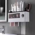 Wall-mounted toothbrush holder set with mouthwash cups and automatic toothpaste dispenser for storage. - Three Cups - Transparent Black