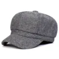 Close-up detail of the classic black and white herringbone tweed newsboy cap texture. - One Size / Light Gray