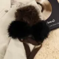 Cozy winter plush earmuffs with soft faux fur pom poms and warm knitted band for cold weather. - Leopard Print Lace-Up Earmuffs - [Coffee]