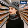 Closeup view of cozy knitted winter beanie and scarf set featuring festive Christmas patterns. - Gray
