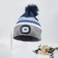 Blue and grey knitted winter beanie hat with built-in LED headlamp and fluffy pom-pom top. - Grey Brim Navy Top