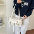 White punk style motorcycle shoulder bag with multiple straps and rivets for women. - White