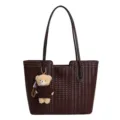 Dark brown woven leather tote bag with cute teddy bear charm, stylish daily shoulder bag. - Coffee