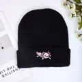 Black knitted beanie hat featuring a cute pink axolotl embroidery, warm autumn winter cap. - Black