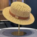 Women hollow out straw hat with brown leather band and metal accents for summer beach vacation. - Khaki Hollow Straw Hat with Belt