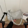 Silver woven shoulder bag with knotted strap, stylish pillow handbag for women and daily wear. - Silver (Without Pendant)