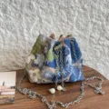 Women resort style floral embroidered sequin bucket shoulder bag for casual holiday party. - Blue