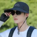 Outdoor sun protection cap with breathable mesh and chin strap for hiking and fishing. - Regular Fit / Black