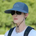 Blue outdoor sun hat with breathable mesh, wide brim, and windproof strap for hiking. - Regular Fit / Dark Gray