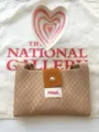 Close-up detail of the knitted crossbody bag showcasing diamond texture and contrast flap. - Camel