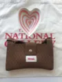 Detailed view of trendy brown knit crossbody bag with heart ceramic dish, stylish travel mini purse. - Dark Brown