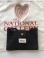 Black knitted crossbody bag with magnetic snap and woven label, trendy small phone purse. - Black