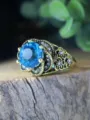 Vintage antique style blue topaz gemstone ring with intricate rose floral filigree design detail. - Size 6