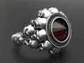Vista dettagliata di un anello teschio in argento punk rock con pietra preziosa rossa unisex - Taglia 7 / Argento Antico Rosso
