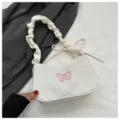 Borsa a tracolla in nylon bianco con ricamo di farfalla rosa e manico arricciato. - senza ciondolo / Bianco