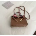 Trendy brown ostrich texture Kelly bag for women with elegant scarf and shoulder strap. - Brown