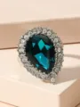 Close-up detail of vintage teardrop blue crystal ring with sparkling rhinestone halo, elegant. - Size 6 / Sapphire Blue