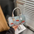 Stylish silver denim barrel handbag with cute cherry embroidery and chic charm for women. - With Pendant / Silver