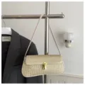 Chic woven straw shoulder bag for women, trendy metallic lock underarm bag for autumn commute. - Off White
