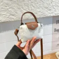 Mini denim dumpling crossbody bag with brown handle, star pattern, trendy fashion handbag. - White
