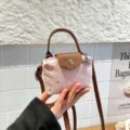 Pink denim mini dumpling crossbody bag with brown leather flap and cute star studs for women - Pink