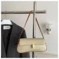 Woven straw shoulder bag with leather trim and gold lock for women, stylish underarm bag. - Brown