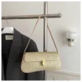 Woven straw shoulder bag for women, stylish metallic lock underarm handbag for autumn commuting. - Khaki