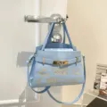 Light blue women handbag luxury fashion tote bag with gold hardware and embroidery strap. - Blue