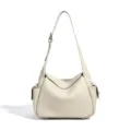 Off-white leather shoulder bag, slouchy crossbody bag with adjustable strap and side pockets. - Milk White